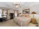 Spacious main bedroom with large bed, ceiling fan, and ample natural light at 2600 Wells Sw Ter, Atlanta, GA 30331