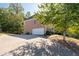 Attached two-car garage with a large driveway at 2600 Wells Sw Ter, Atlanta, GA 30331