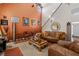 Living room with high ceilings, fireplace and ample seating at 2600 Wells Sw Ter, Atlanta, GA 30331