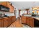 Spacious kitchen with wood cabinets, tile countertops, and modern appliances at 2600 Wells Sw Ter, Atlanta, GA 30331