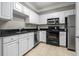 Well-equipped kitchen with white cabinets and stainless steel appliances at 1850 Cotillion Dr # 3215, Atlanta, GA 30338