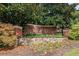 Madison Square community entrance sign with brick pillars and stonework at 1850 Cotillion Dr # 3215, Atlanta, GA 30338