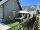 Relaxing hammock area with artificial turf and modern umbrella at 1248 Windmill Pkwy # 240, Cumming, GA 30041