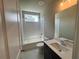 Updated bathroom with bathtub, toilet, and single vanity at 312 Willow Cv, Canton, GA 30114