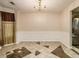 Dining area with tile floor and view into the kitchen at 2558 Rainmaker Dr, Decatur, GA 30034