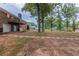 Large backyard with mature trees and a patio at 3689 Laurie Woods Ln, Decatur, GA 30034