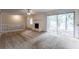 Living room with fireplace, sliding glass doors, and neutral carpet at 3689 Laurie Woods Ln, Decatur, GA 30034