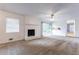 Bright living room featuring a fireplace and sliding glass doors at 3689 Laurie Woods Ln, Decatur, GA 30034