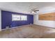Large bedroom with a purple accent wall and ceiling fan at 3689 Laurie Woods Ln, Decatur, GA 30034