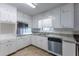 Bright kitchen with white cabinets, stainless steel appliances, and granite countertops at 3689 Laurie Woods Ln, Decatur, GA 30034