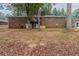 Brick house with a large backyard, partially wooded, and a stone pathway at 3689 Laurie Woods Ln, Decatur, GA 30034