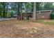 Brick house with a spacious backyard, partially wooded, and a stone pathway at 3689 Laurie Woods Ln, Decatur, GA 30034