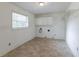 Laundry room with tile floor, cabinets, and shelving at 3689 Laurie Woods Ln, Decatur, GA 30034