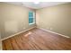 Small bedroom with laminate wood flooring and window at 158 Ilex Dr, Canton, GA 30114