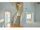 Elegant staircase with wooden handrail leading to upper levels at 3904 Duran Dr, Auburn, GA 30011