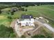 Luxury home under construction with unique turrets and large backyard at 1197 Dee Kennedy Rd, Auburn, GA 30011
