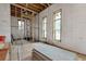 Unfinished basement room with two windows and exposed framing at 1197 Dee Kennedy Rd, Auburn, GA 30011
