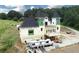 An under construction home with a unique architectural design is situated on a large lot with scenic views at 1197 Dee Kennedy Rd, Auburn, GA 30011