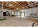 Unfinished basement with exposed framing and large windows at 1197 Dee Kennedy Rd, Auburn, GA 30011