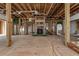 Unfinished great room with fireplace framing and exposed beams at 1197 Dee Kennedy Rd, Auburn, GA 30011