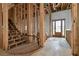 Interior view of a new home's staircase under construction, showcasing the curved design and framing at 1197 Dee Kennedy Rd, Auburn, GA 30011
