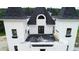 Chateau-style home with a large rooftop deck and stunning architectural features at 1197 Dee Kennedy Rd, Auburn, GA 30011