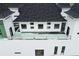 Modern home with a large rooftop deck and beautiful landscaping at 1197 Dee Kennedy Rd, Auburn, GA 30011