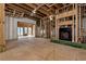 Open living room with a fireplace and access to outdoor spaces, under construction at 1197 Dee Kennedy Rd, Auburn, GA 30011