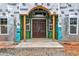 The front entrance of a new home construction featuring a double door and arched entryway at 1197 Dee Kennedy Rd, Auburn, GA 30011