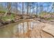 Peaceful creek running through wooded area at 1197 Dee Kennedy Rd, Auburn, GA 30011