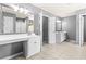 Double vanity bathroom with updated white cabinets at 150 Klondike Sw St, Atlanta, GA 30331