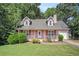 Charming pink house with a front porch and yard at 2606 Clifton Downs Se Trl, Atlanta, GA 30316