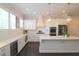 Spacious kitchen with white cabinets, quartz countertops, and stainless steel appliances at 261 Cherokee Ne St, Marietta, GA 30060