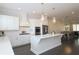 Open concept kitchen with white cabinets and island at 261 Cherokee Ne St, Marietta, GA 30060