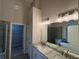 Modern bathroom featuring double vanity, soaking tub, and walk-in shower at 5544 Whispering Swan Ct, Douglasville, GA 30135