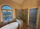 Bathroom boasting walk-in shower, soaking tub, and access to the closet at 5544 Whispering Swan Ct, Douglasville, GA 30135