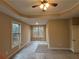 Spacious bedroom with large windows and tray ceiling at 5544 Whispering Swan Ct, Douglasville, GA 30135