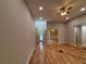 View of the hallway, dining room, and front door with hardwood floors at 5544 Whispering Swan Ct, Douglasville, GA 30135