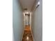 Hardwood floor hallway leading to bedrooms and bathrooms at 5544 Whispering Swan Ct, Douglasville, GA 30135