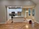 Open-concept kitchen and dining area with white cabinets and island at 5544 Whispering Swan Ct, Douglasville, GA 30135