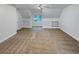 Large bonus room with built-in shelving and window at 1512 Maplewood Ct, Woodstock, GA 30189