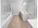 Spacious bathroom with soaking tub, shower, and double vanity at 1512 Maplewood Ct, Woodstock, GA 30189