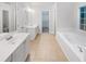 Elegant bathroom with double vanity, garden tub, and separate shower at 1512 Maplewood Ct, Woodstock, GA 30189