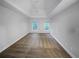 Spacious bedroom with neutral carpeting and two large windows at 1512 Maplewood Ct, Woodstock, GA 30189