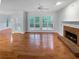 Gathering room featuring hardwood floors and brick fireplace at 1512 Maplewood Ct, Woodstock, GA 30189
