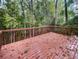 Wooden deck overlooking a wooded backyard at 1512 Maplewood Ct, Woodstock, GA 30189