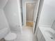 Clean bathroom with single vanity, toilet and shower at 1512 Maplewood Ct, Woodstock, GA 30189