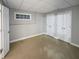 Spacious finished basement room with neutral walls and carpeting at 1512 Maplewood Ct, Woodstock, GA 30189