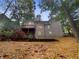 Two story house exterior with deck and wooded backyard at 1512 Maplewood Ct, Woodstock, GA 30189