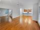 Open concept living space with hardwood floors and kitchen view at 1512 Maplewood Ct, Woodstock, GA 30189